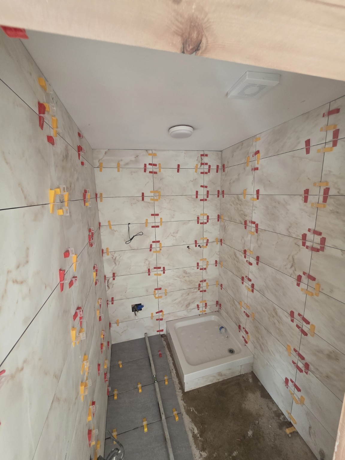 Bathroom tiling in progress